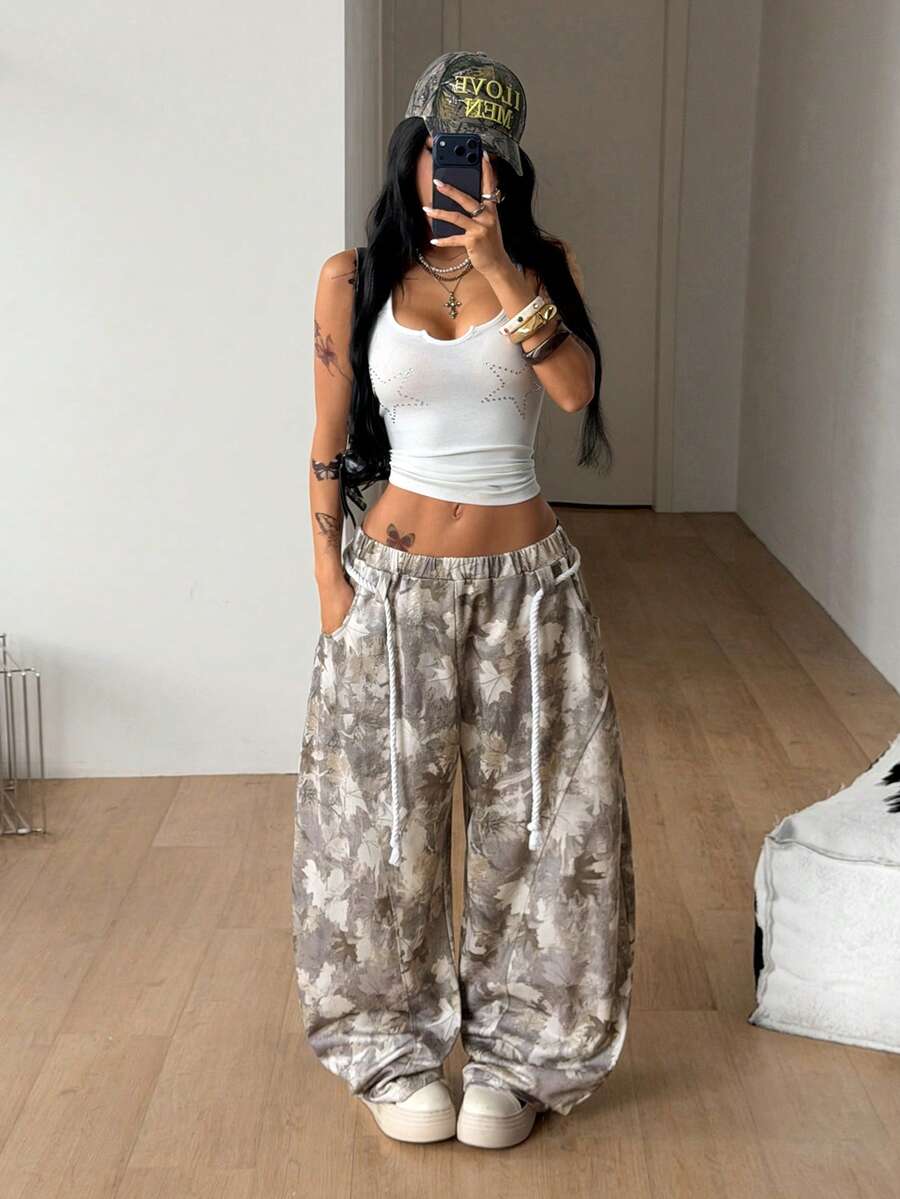 Women's casual grey plaid sweatpants featuring an elastic drawstring waistband, side pockets, and a relaxed loose fit.