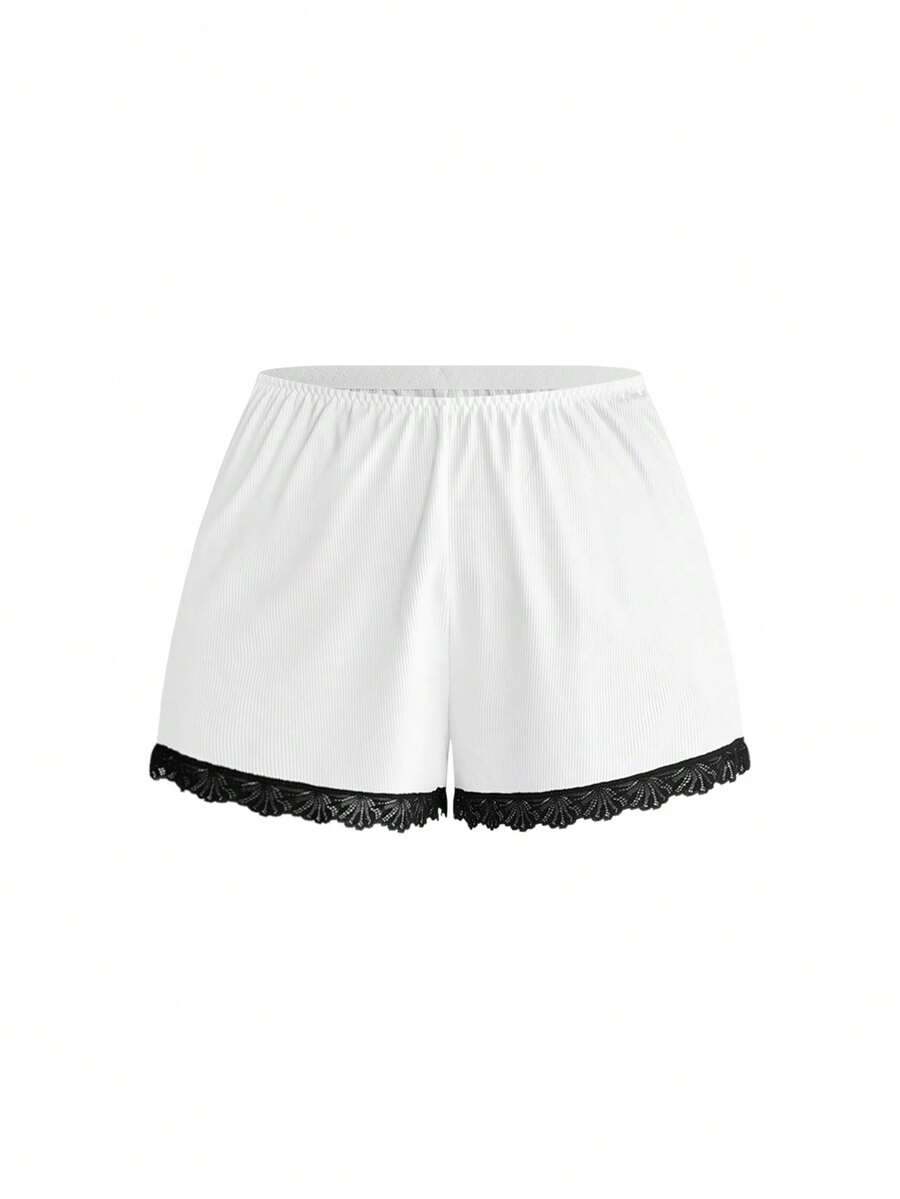Two-piece ribbed pajama set featuring a lace-trimmed crop camisole top with spaghetti straps and matching shorts.
