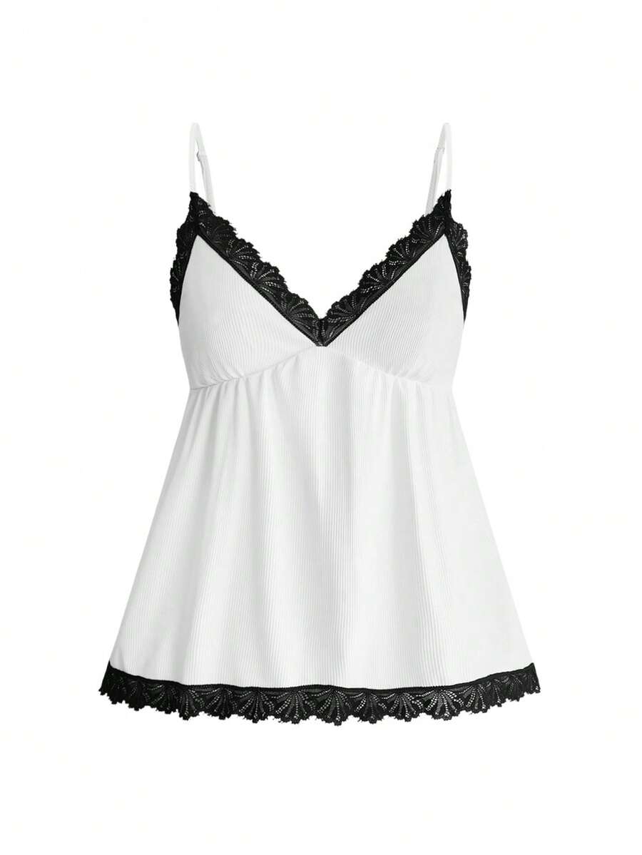 Two-piece ribbed pajama set featuring a lace-trimmed crop camisole top with spaghetti straps and matching shorts.