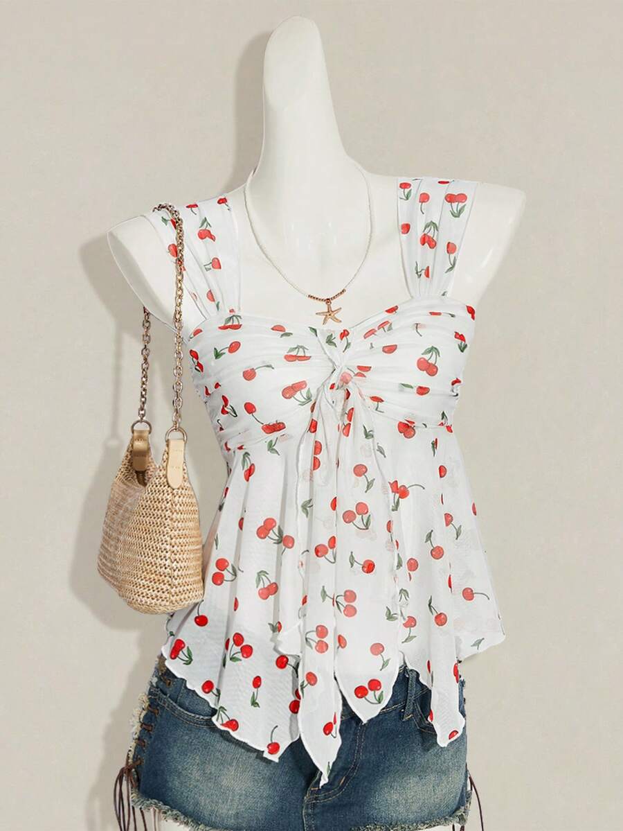 Women's white cherry print cami top with wide straps, ruched knot detail, and an asymmetrical hem
