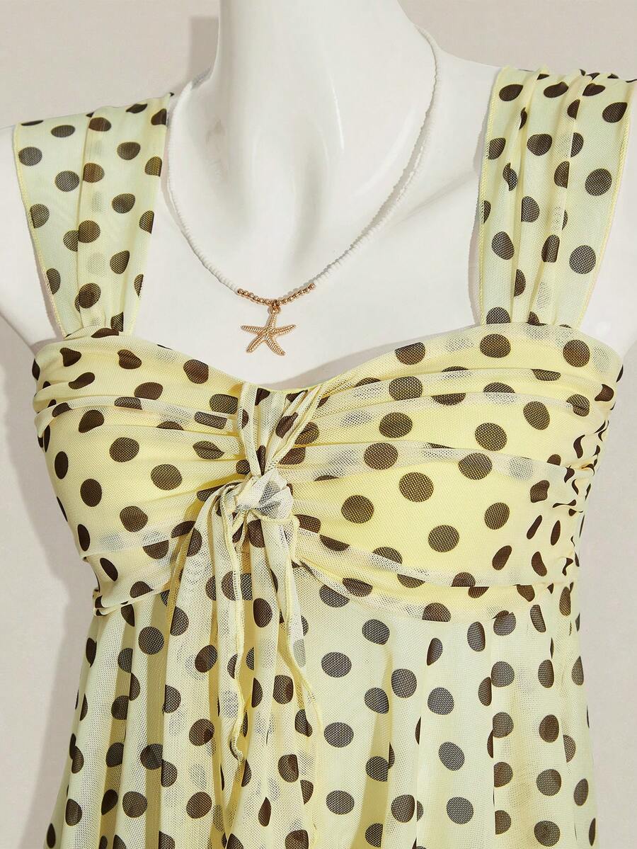 Women's white cherry print cami top with wide straps, ruched knot detail, and an asymmetrical hem
