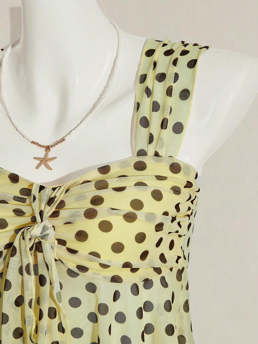Women's white cherry print cami top with wide straps, ruched knot detail, and an asymmetrical hem