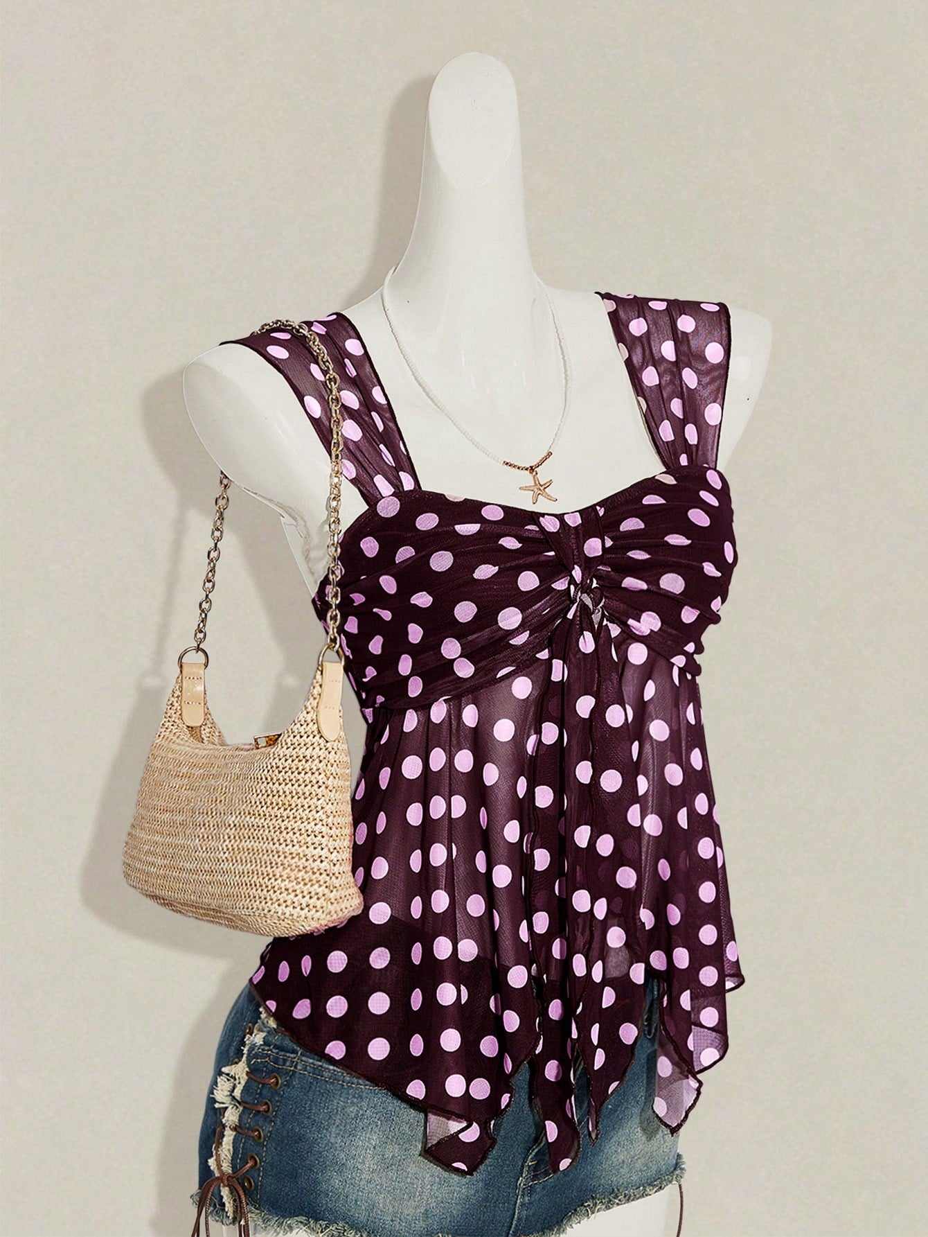 Women's white cherry print cami top with wide straps, ruched knot detail, and an asymmetrical hem