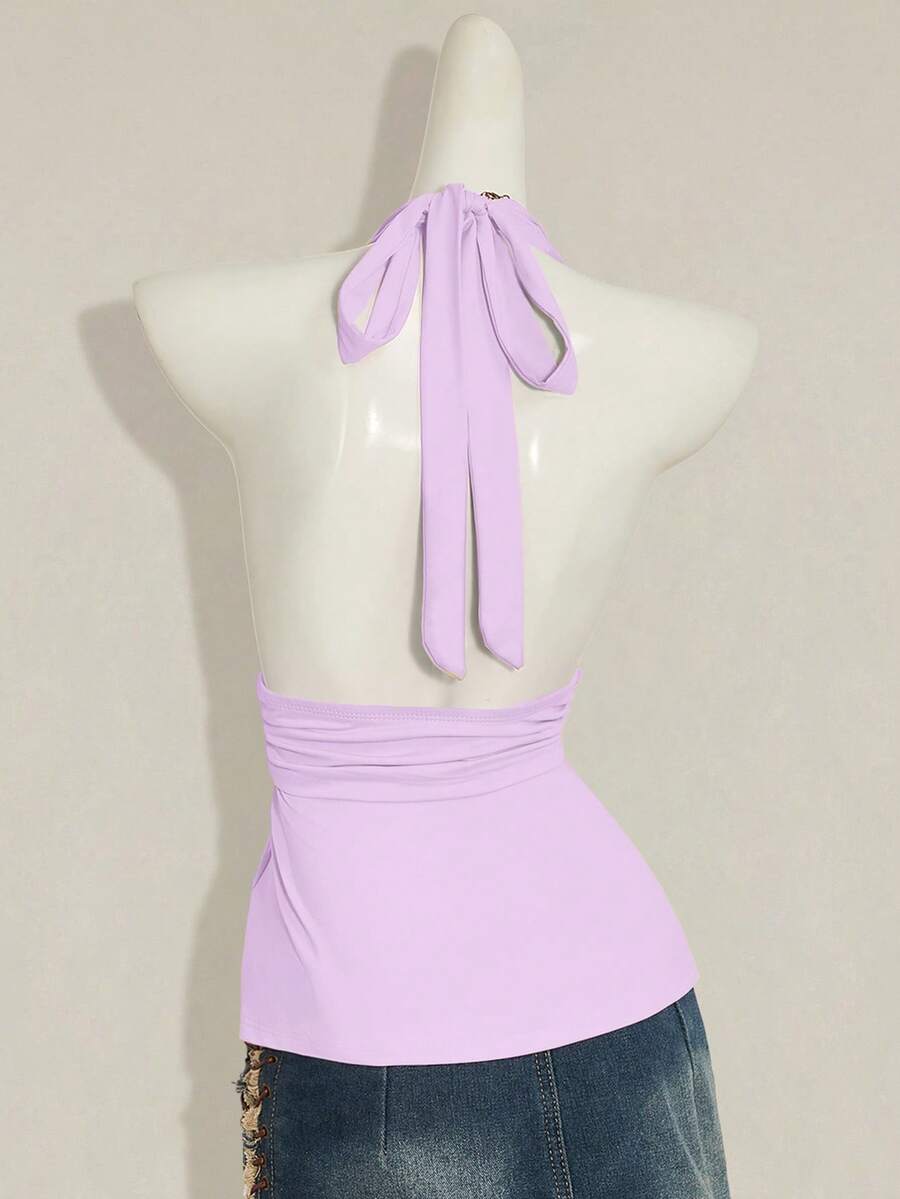 Women's backless halter babydoll tank top featuring a square neckline, slim fit silhouette, and a flared ruffle hem.