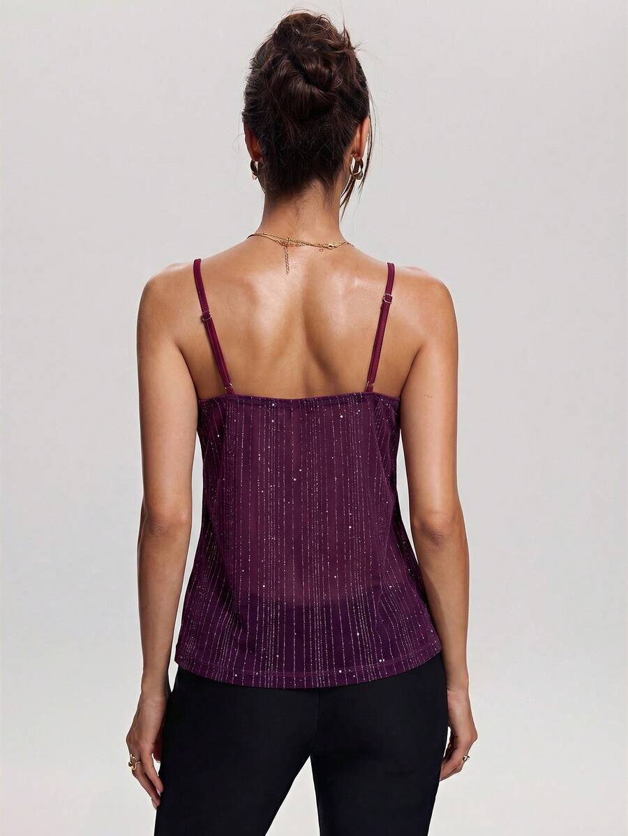 Women's backless spaghetti strap camisole top featuring contrast lace details, knot accents, and a slim fit.