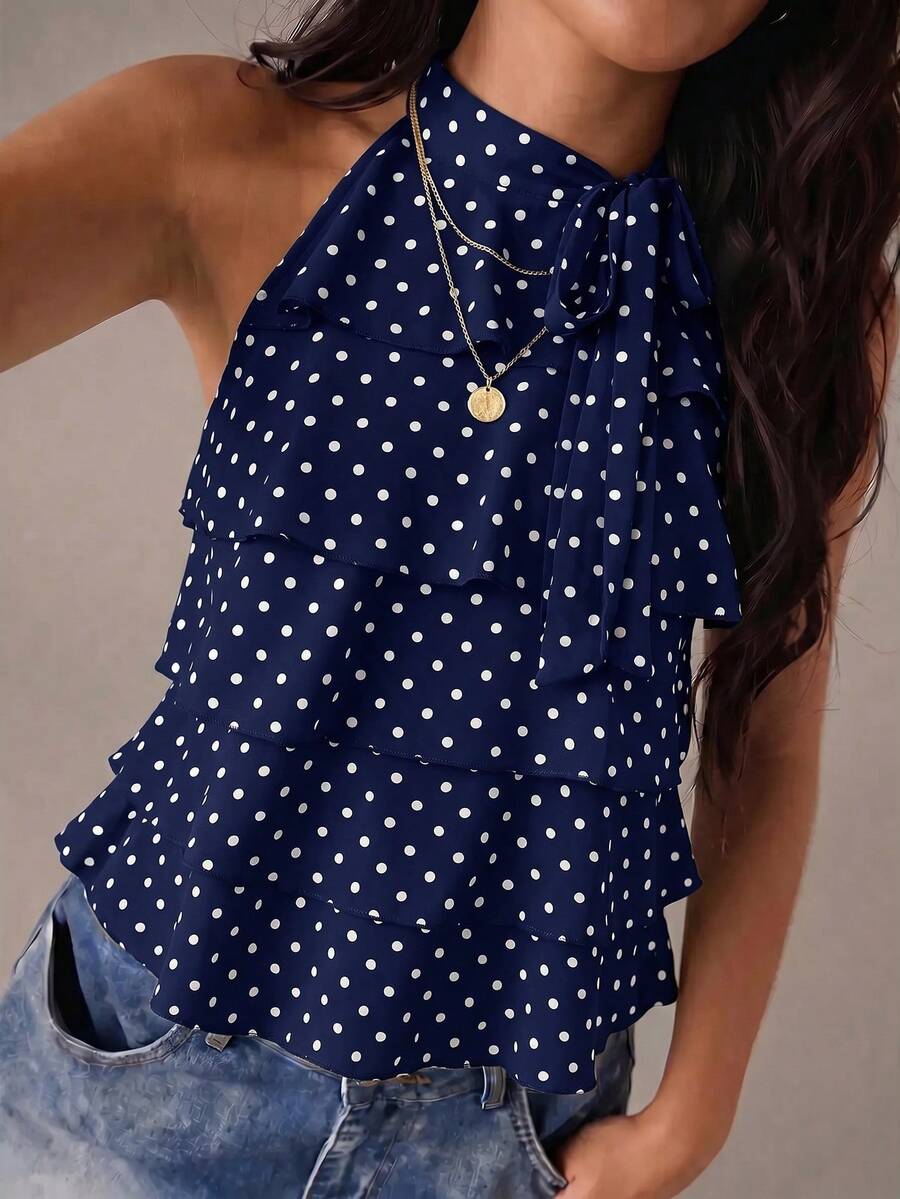 Women's sleeveless stand collar top in rib-knit fabric featuring button and hollow-out details.