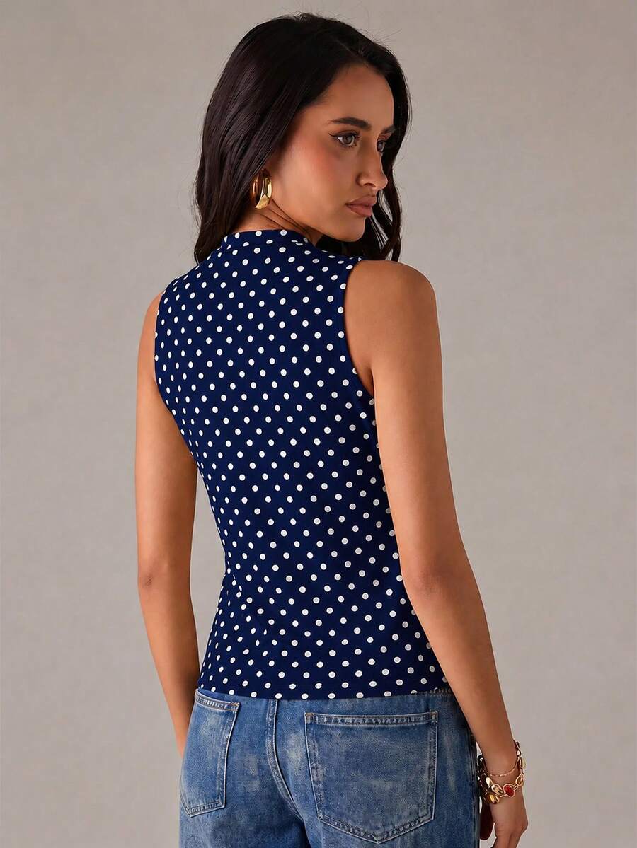 Women's sleeveless stand collar top in rib-knit fabric featuring button and hollow-out details.