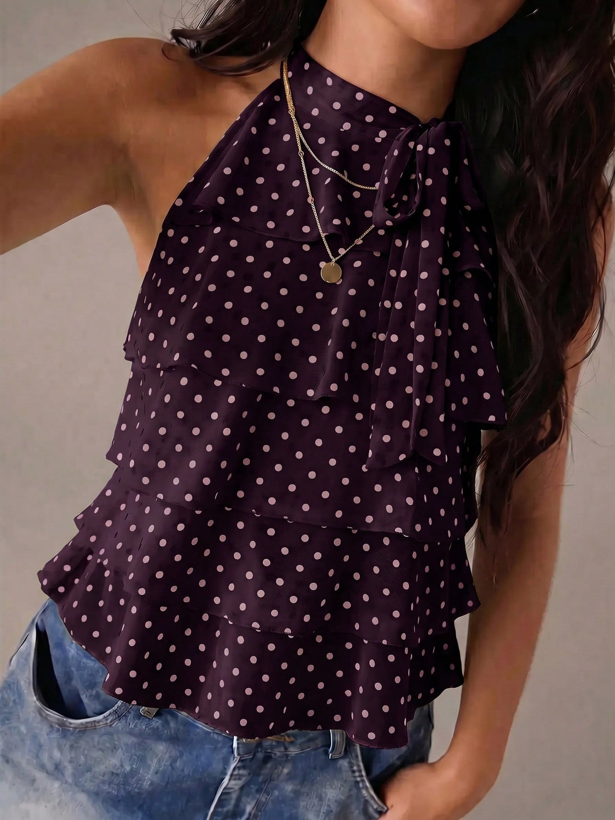 Women's sleeveless stand collar top in rib-knit fabric featuring button and hollow-out details.