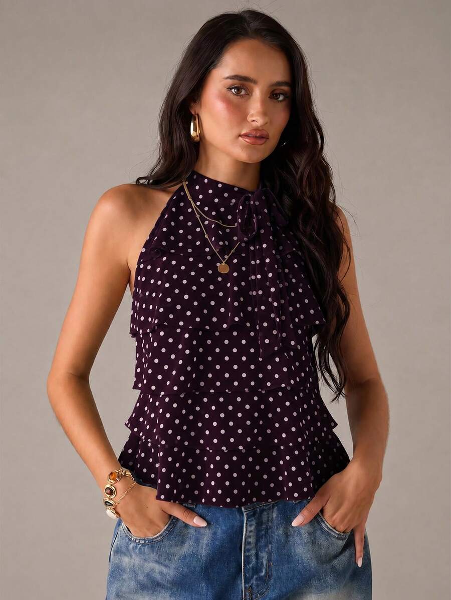 Women's sleeveless stand collar top in rib-knit fabric featuring button and hollow-out details.