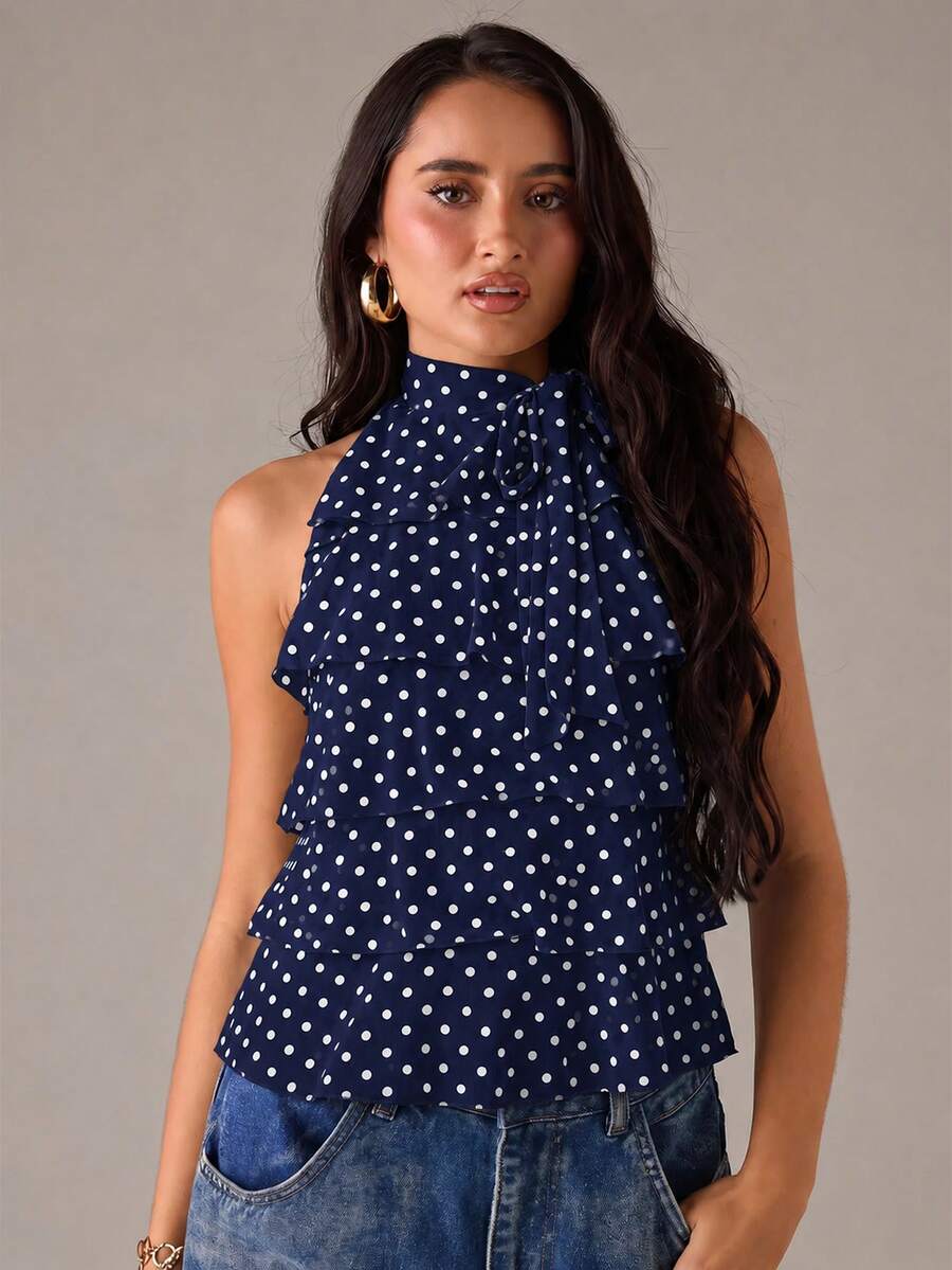 Women's sleeveless stand collar top in rib-knit fabric featuring button and hollow-out details.