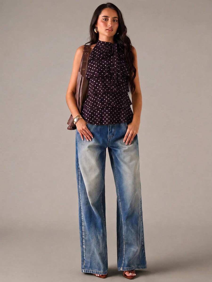 Women's sleeveless stand collar top in rib-knit fabric featuring button and hollow-out details.