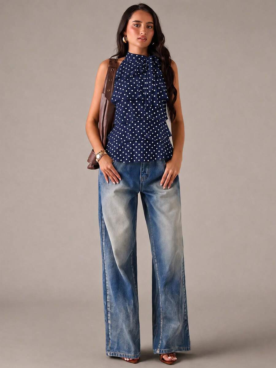 Women's sleeveless stand collar top in rib-knit fabric featuring button and hollow-out details.