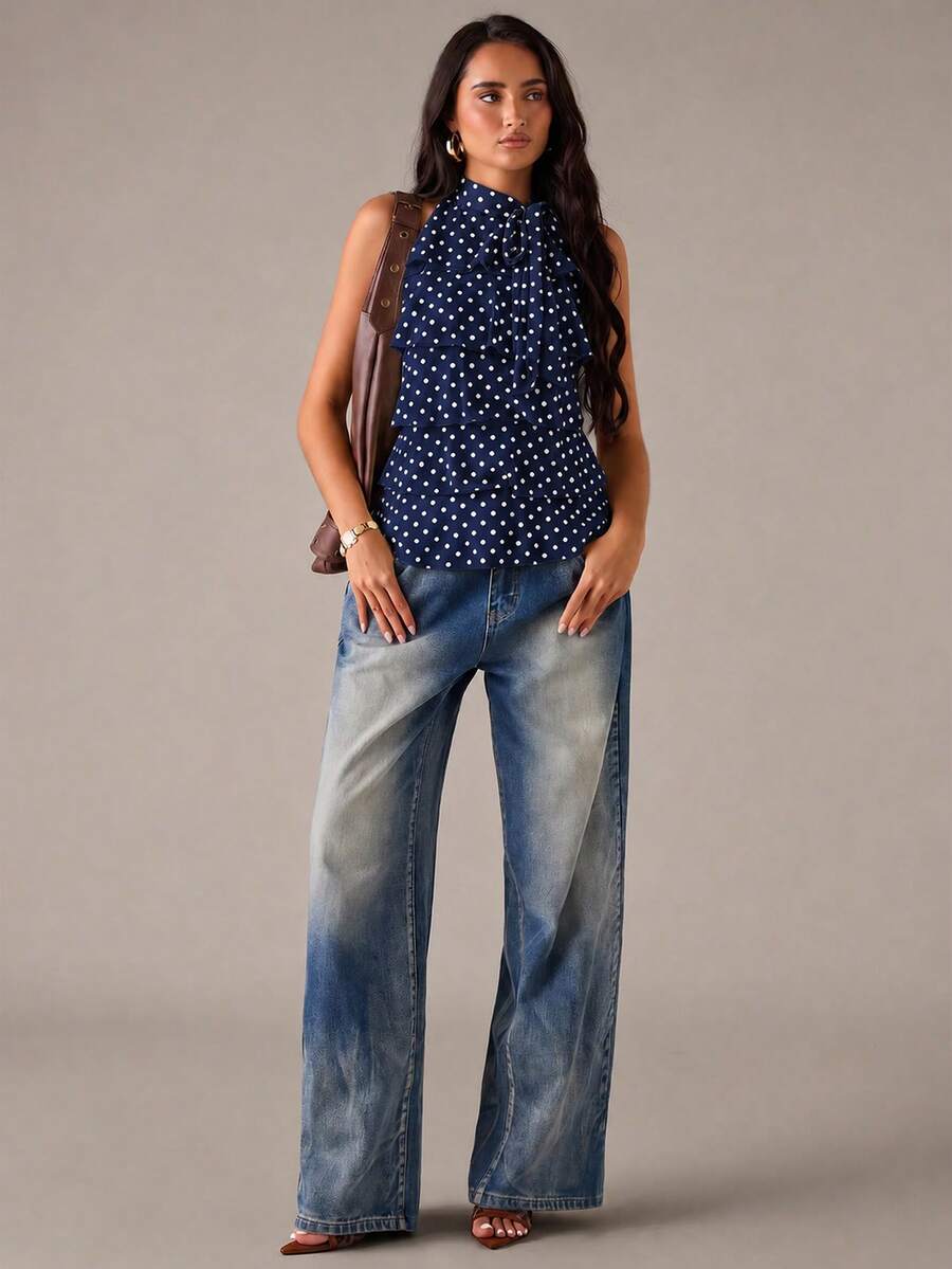 Women's sleeveless stand collar top in rib-knit fabric featuring button and hollow-out details.
