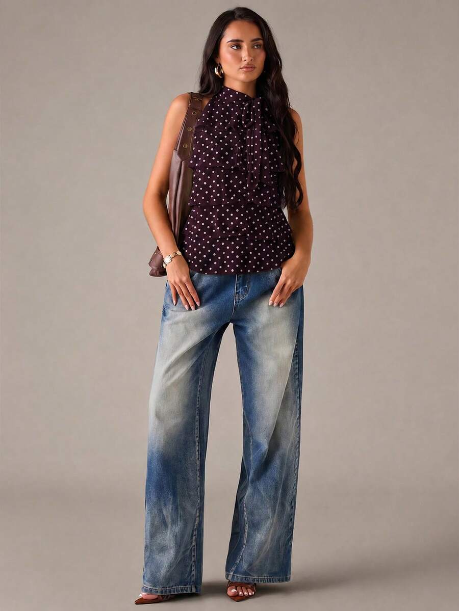 Women's sleeveless stand collar top in rib-knit fabric featuring button and hollow-out details.