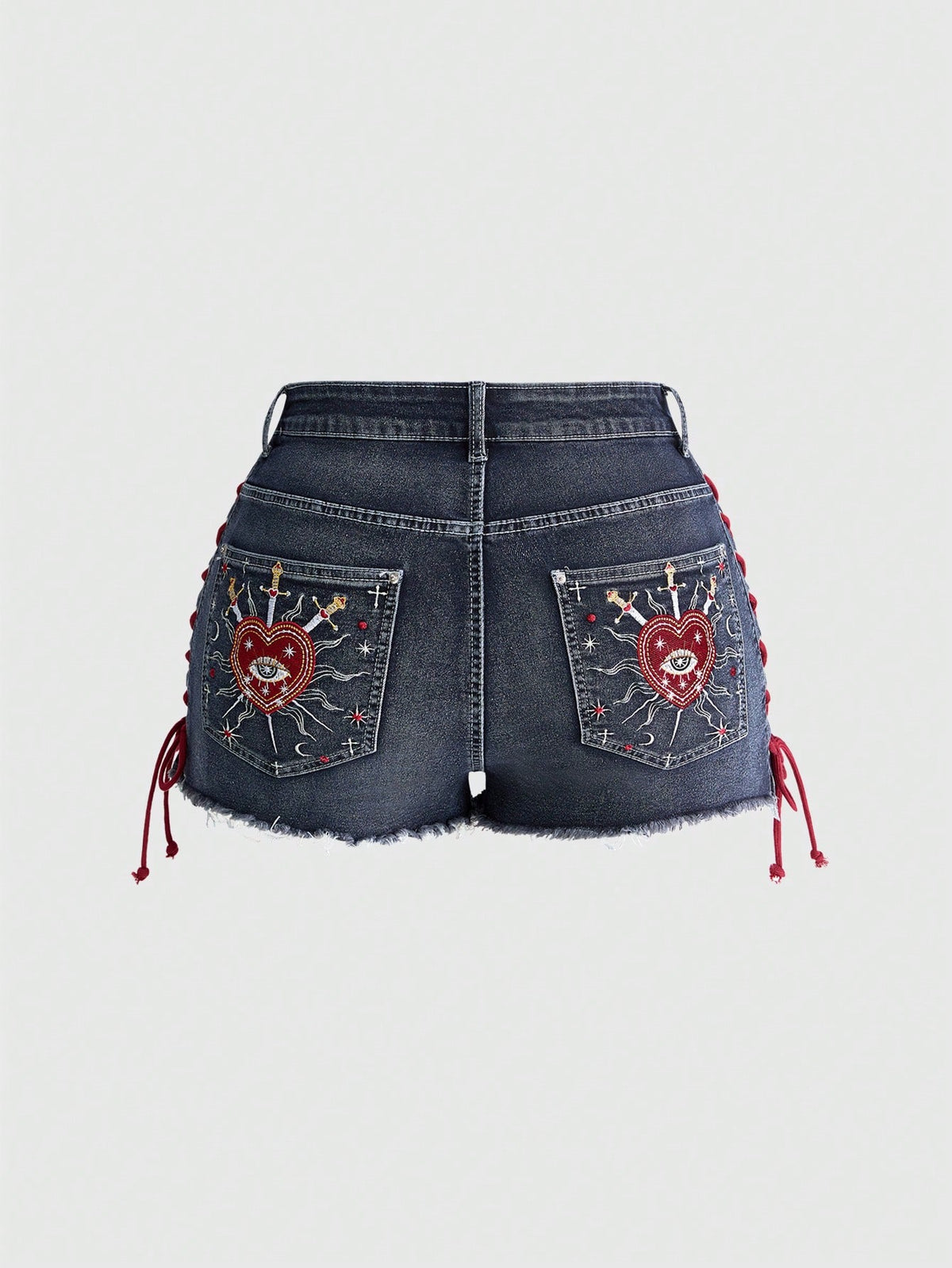 Plus size black gothic mini shorts with heart embroidery, graphic pocket pattern, lace-up detail, raw hem, and zipper fly