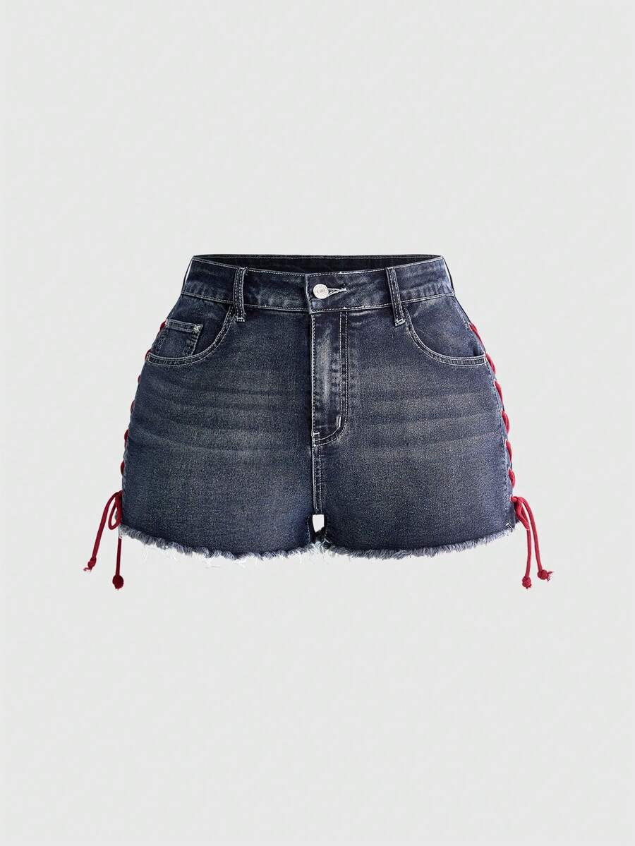 Plus size black gothic mini shorts with heart embroidery, graphic pocket pattern, lace-up detail, raw hem, and zipper fly