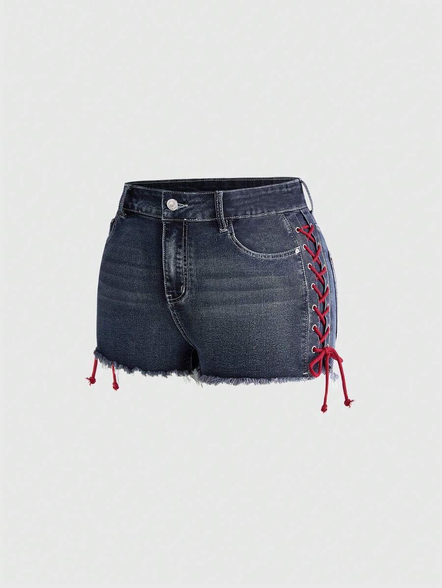 Plus size black gothic mini shorts with heart embroidery, graphic pocket pattern, lace-up detail, raw hem, and zipper fly