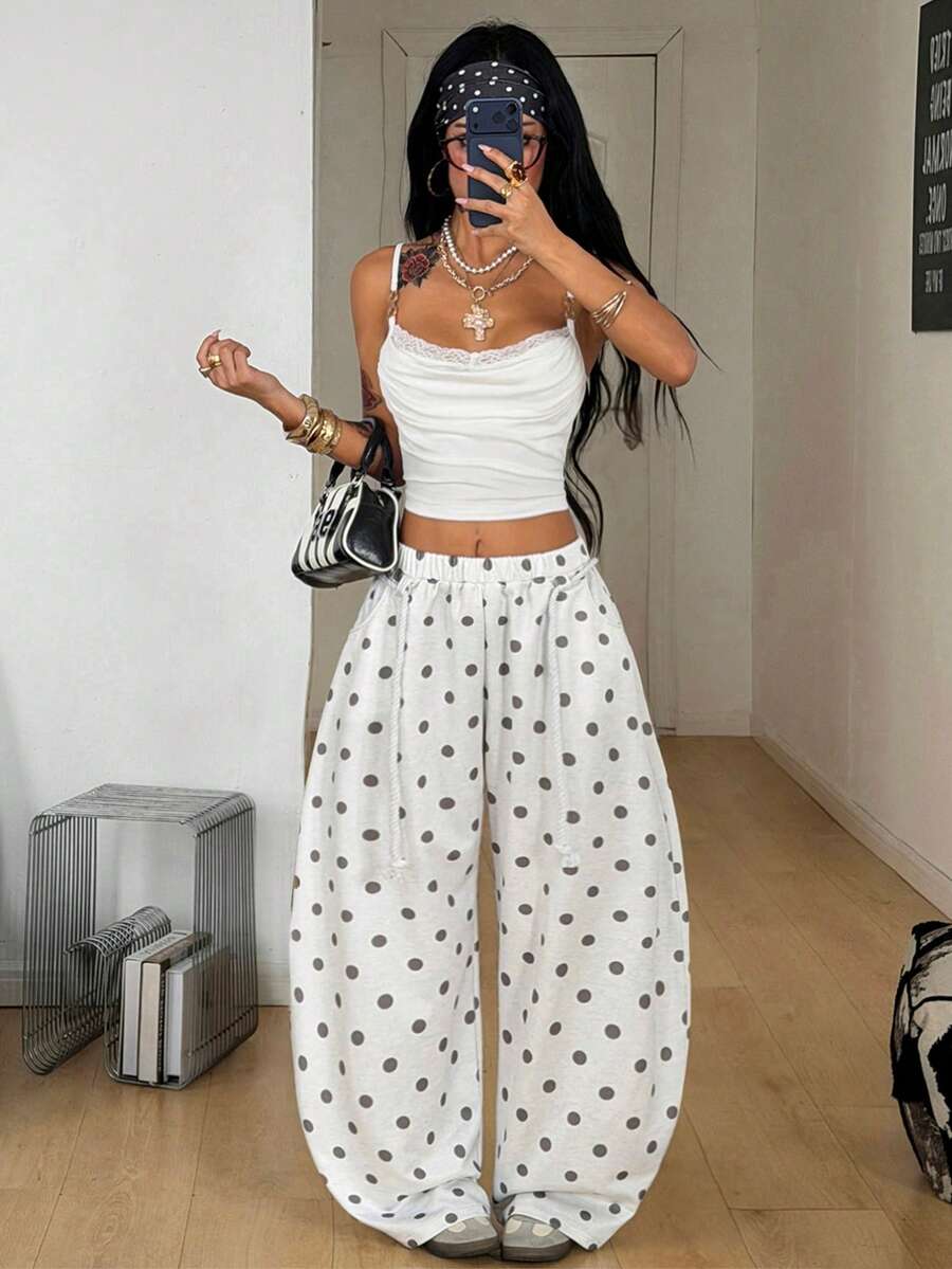 Women's casual grey plaid sweatpants featuring an elastic drawstring waistband, side pockets, and a relaxed loose fit.