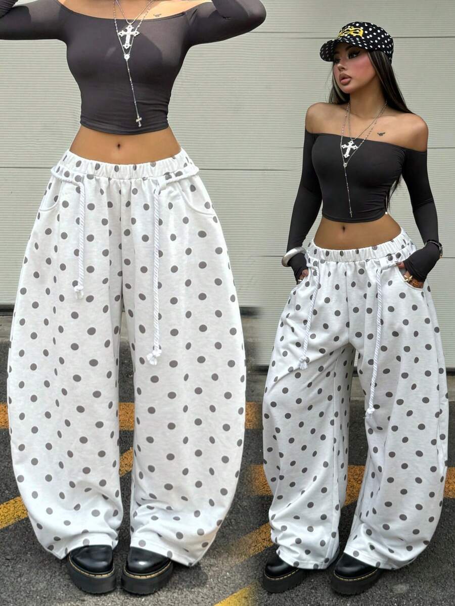 Women's casual grey plaid sweatpants featuring an elastic drawstring waistband, side pockets, and a relaxed loose fit.