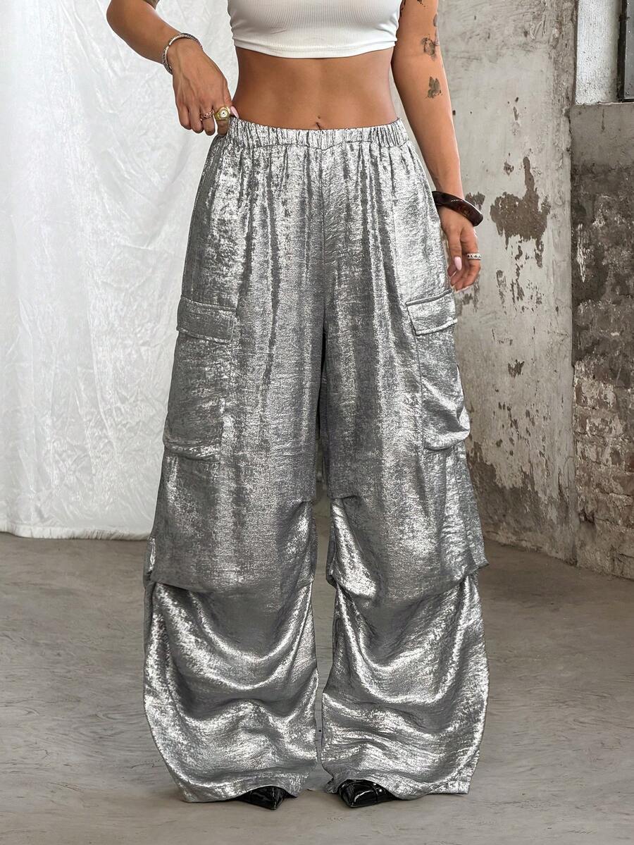 Women's high waist wide leg cargo pants featuring a black and white tree branch print and adjustable drawstring closure.