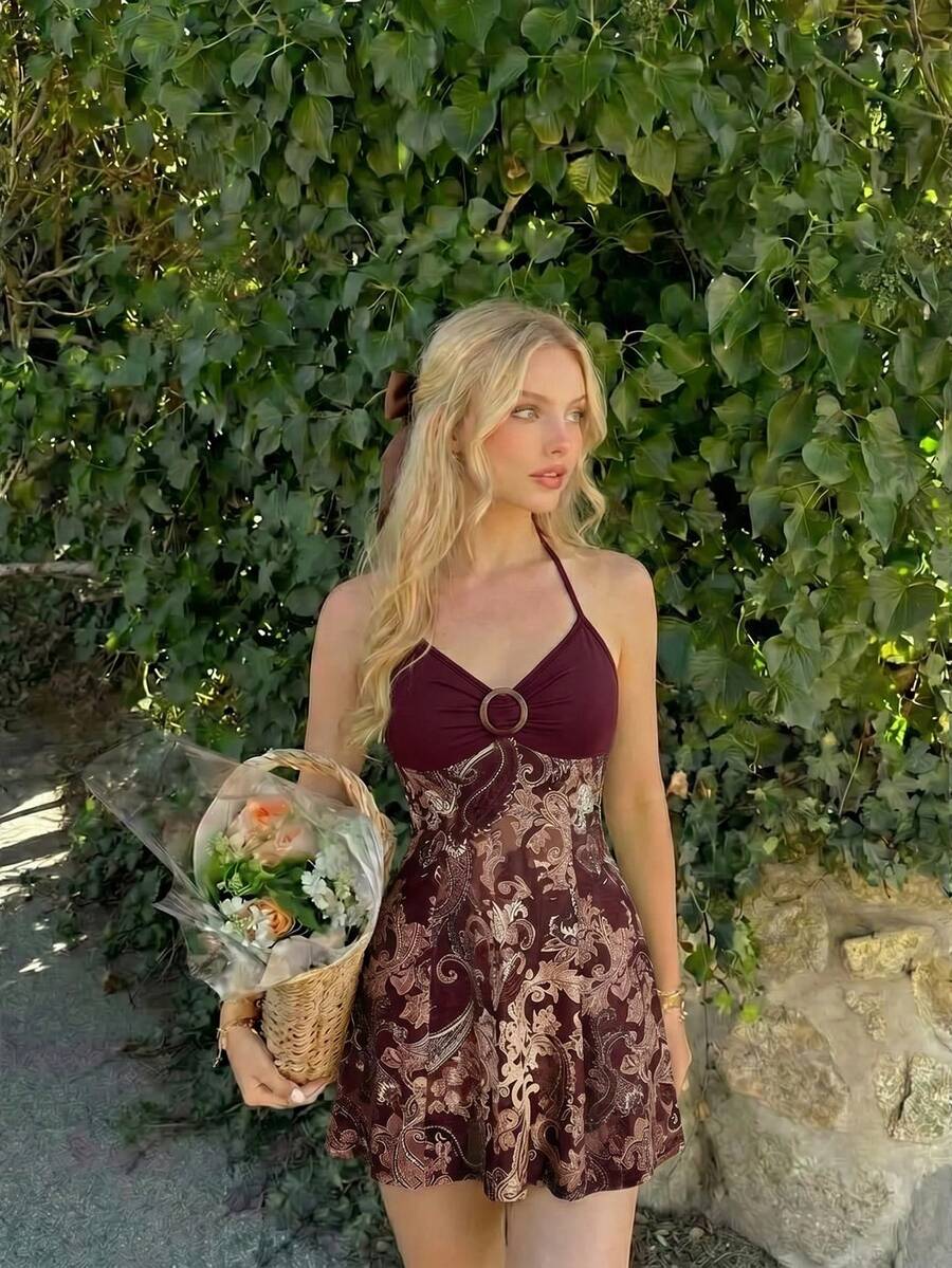 Women's apricot halter mini dress with backless knot and ring detail, sleeveless cami style, flared hem, and boho vacation look