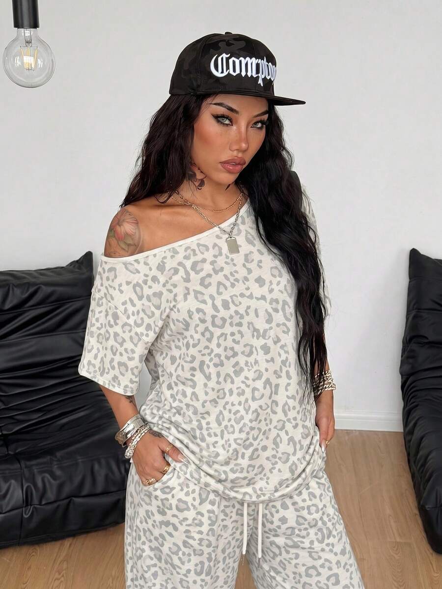Women's two-piece outfit featuring an oversized asymmetrical neck t-shirt and matching wide-leg drawstring sweatpants.