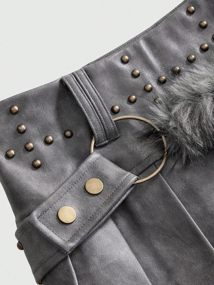 Women's low waist brown PU leather mini skirt featuring contrast fuzzy faux fur trim and grommet eyelet accents.