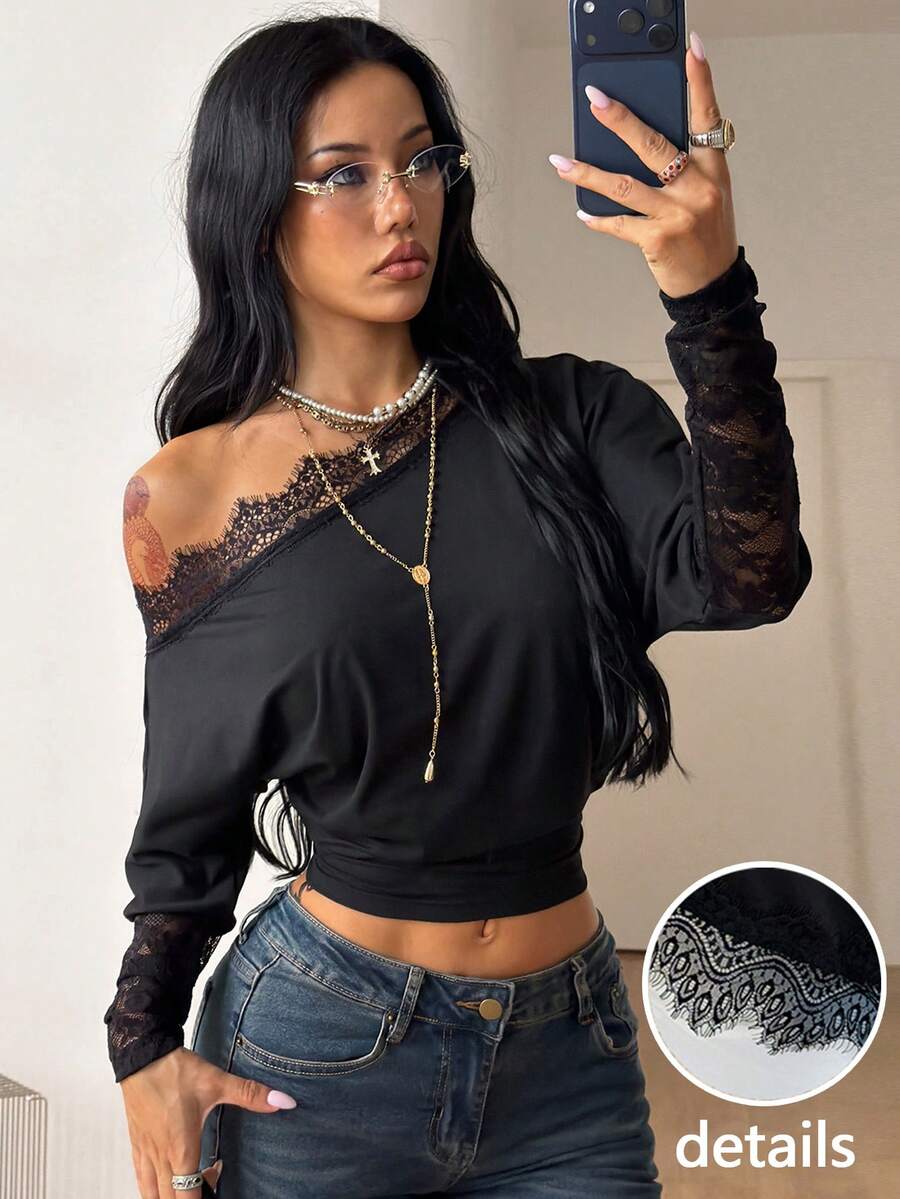 Women's black long sleeve t-shirt featuring delicate contrast lace details and a boat neckline in a knitted stretch fabric.