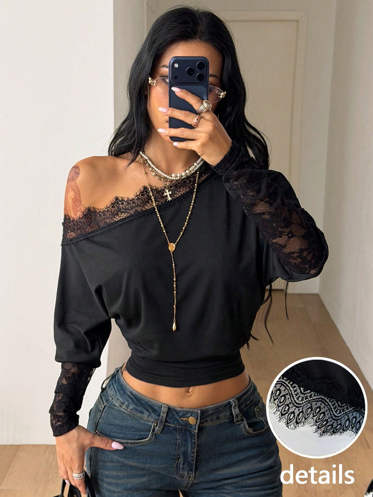 Women's black long sleeve t-shirt featuring delicate contrast lace details and a boat neckline in a knitted stretch fabric.