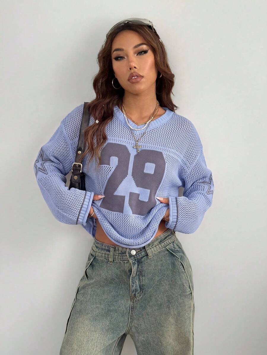 Women's oversized long sleeve knit pullover sweater with round neck, drop shoulder design, and front pocket detail.