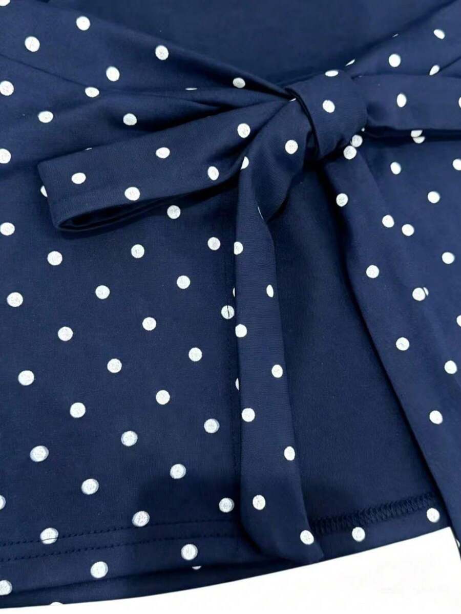 Women's cowl neck tie polka dot pleated tank blouse with ruched details and a regular fit