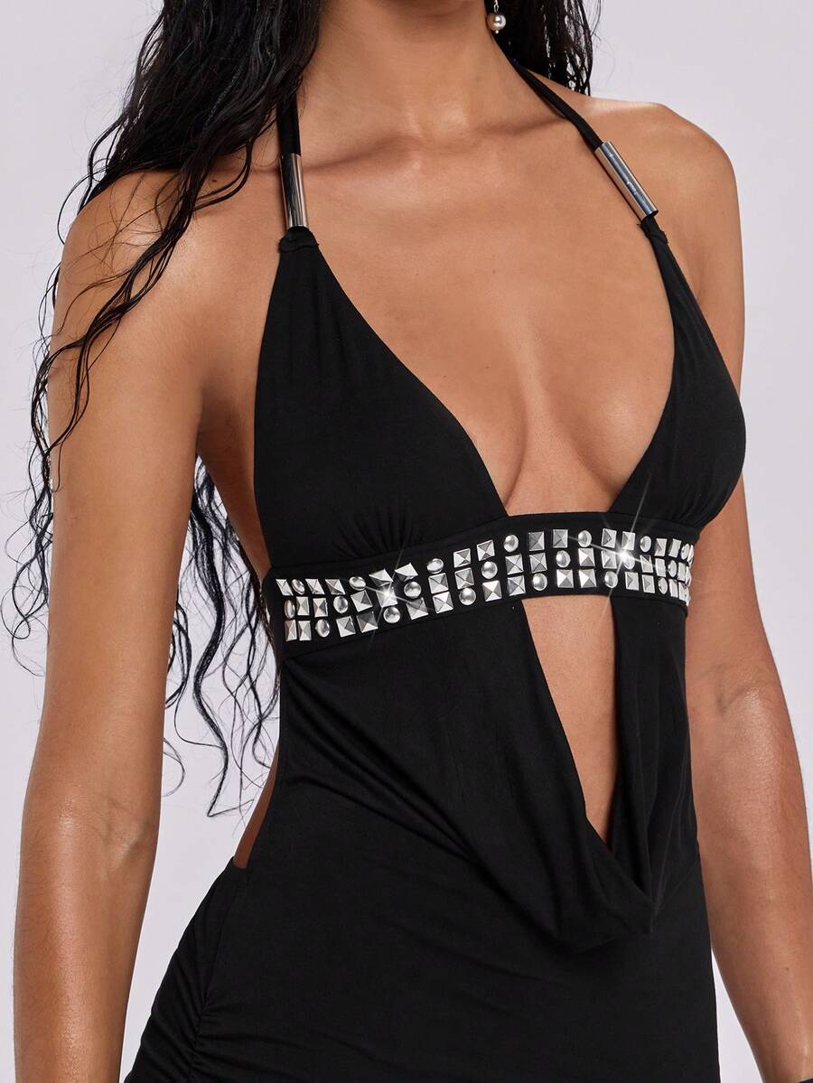 Women's slim fit halter neck bodycon mini dress featuring a backless design with knot tie back details.
