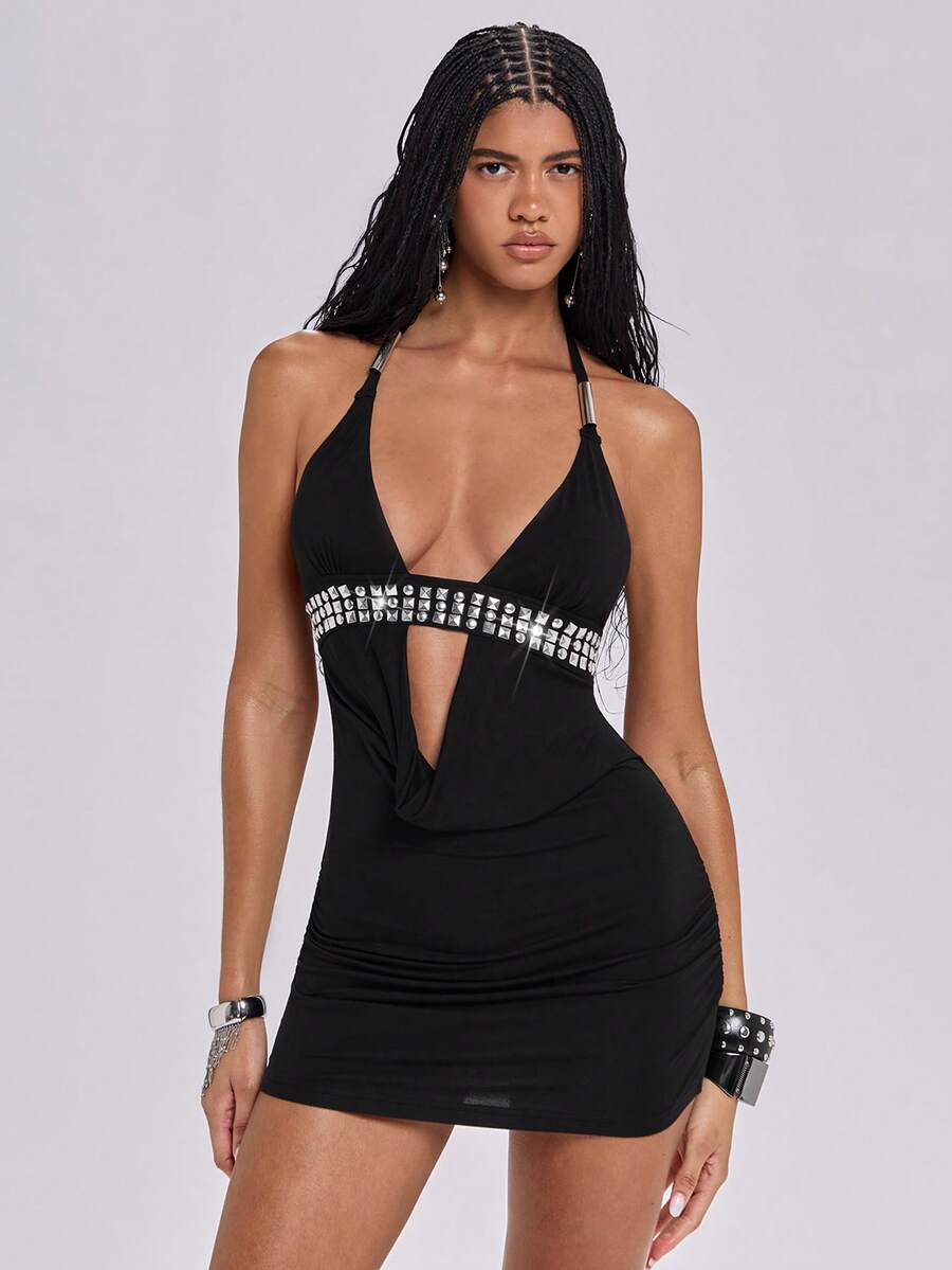 Women's slim fit halter neck bodycon mini dress featuring a backless design with knot tie back details.
