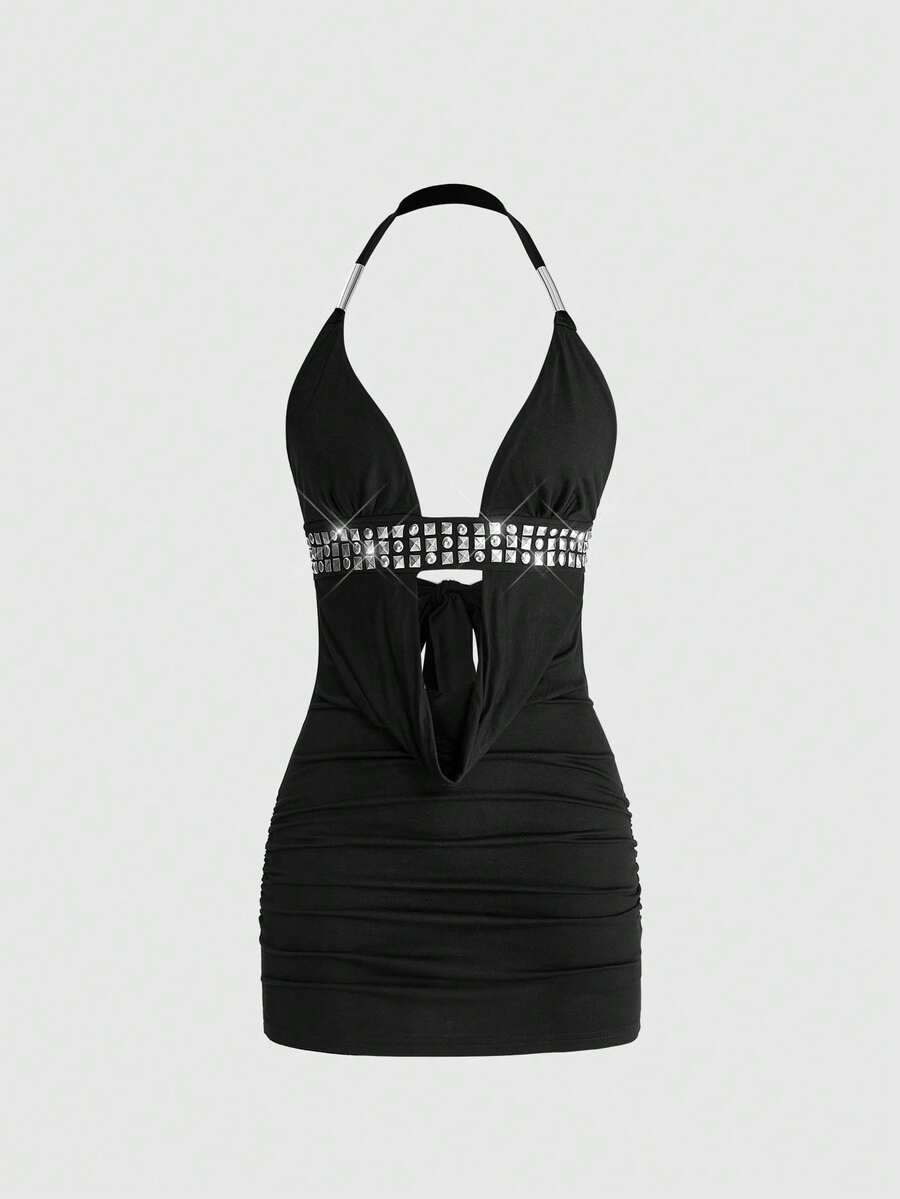 Women's slim fit halter neck bodycon mini dress featuring a backless design with knot tie back details.