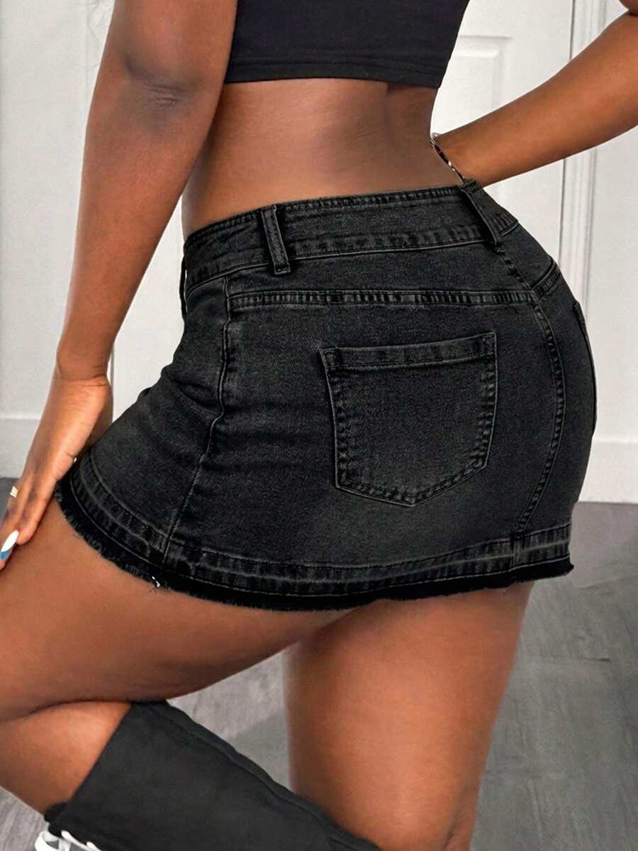 Women's black low waist bodycon mini skirt with button detail, pockets, and zipper closure