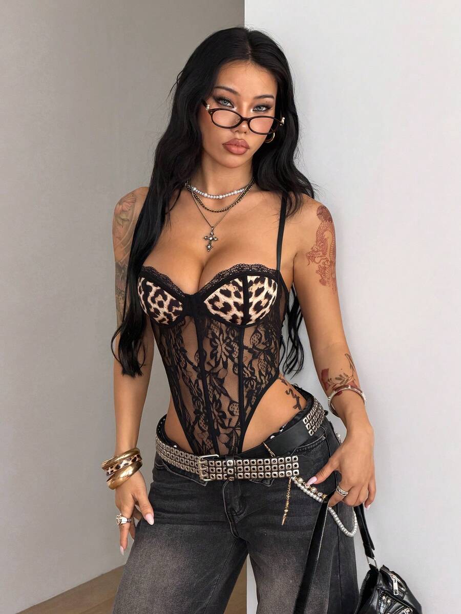 Fitted women's lace and mesh cami bodysuit with spaghetti straps.