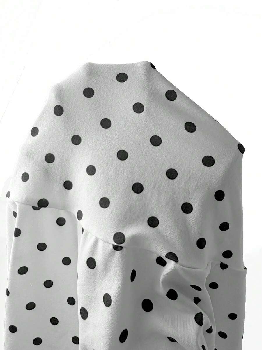 Women's black and white polka dot cami mini dress with contrast lace trim, spaghetti straps, and slim pencil fit.