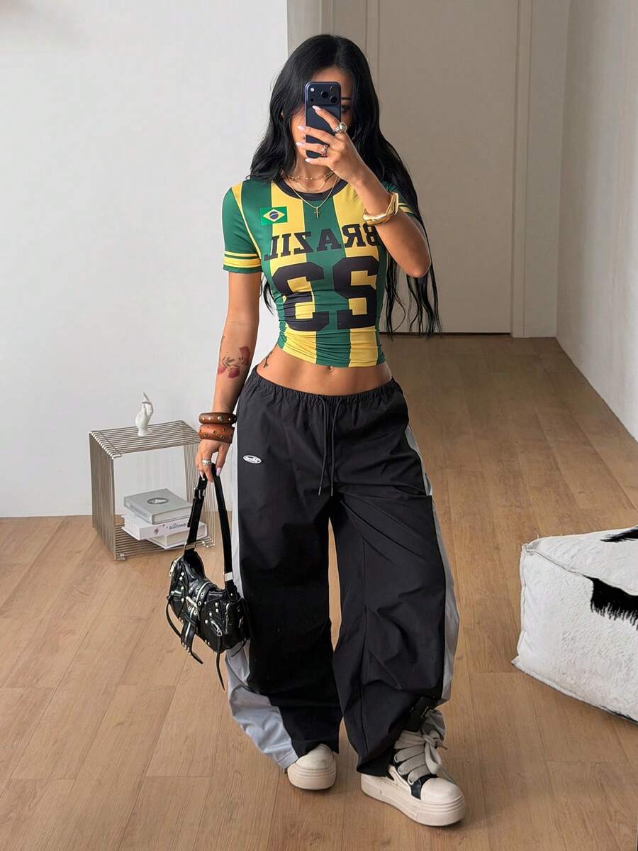 Women's slim fit short sleeve graphic jersey style top with contrast binding and round neckline