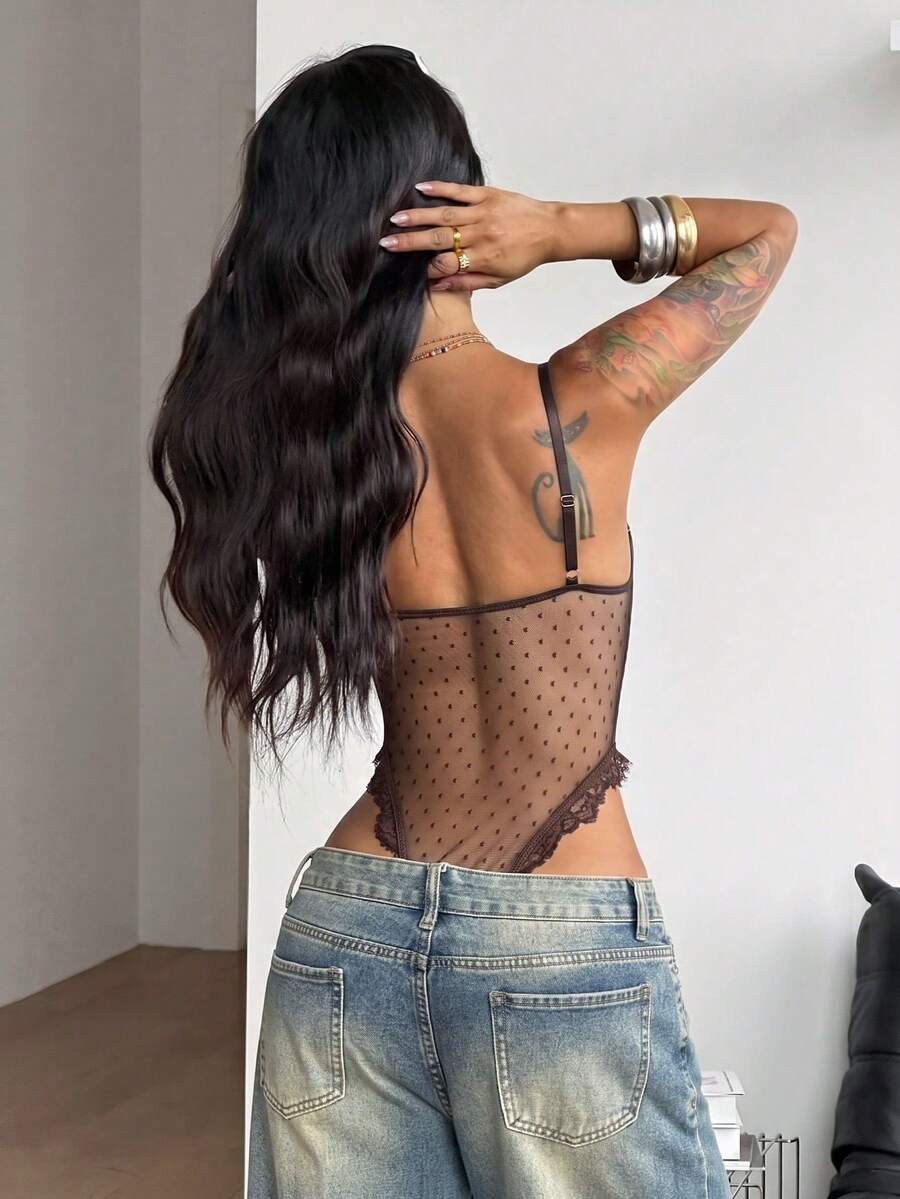 Fitted women's lace and mesh cami bodysuit with spaghetti straps.