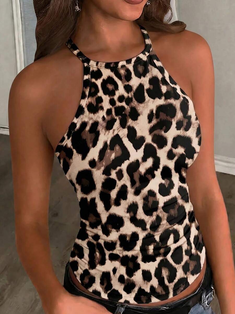 Multicolor women's graphic print halter tank top featuring a round neck, contrast binding, and backless design.