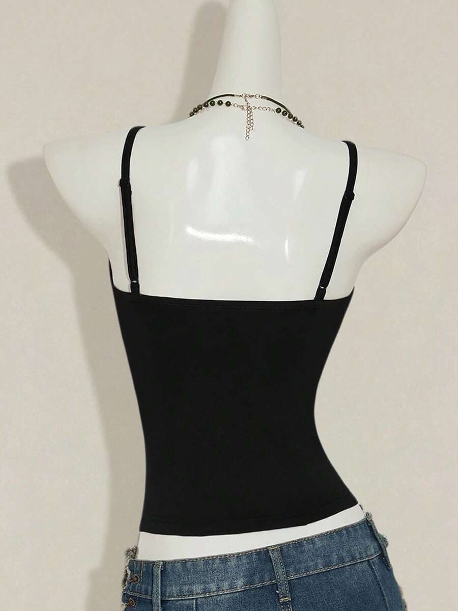 Women's floral embroidered sequin camisole top with thin spaghetti straps and a slim fit design.