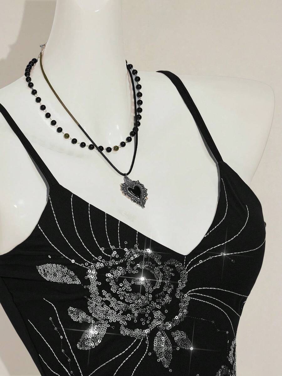 Women's floral embroidered sequin camisole top with thin spaghetti straps and a slim fit design.