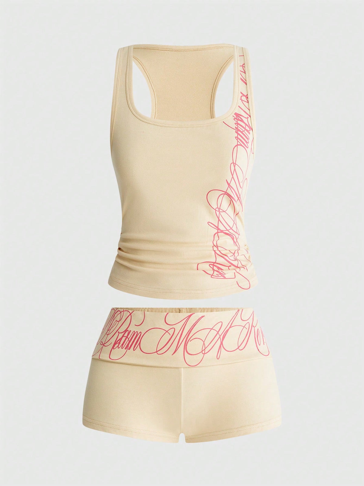 Punk-inspired two-piece set with a fitted scoop neck slogan tank top featuring cross and rhinestone details paired with ultra low waist mini shorts.