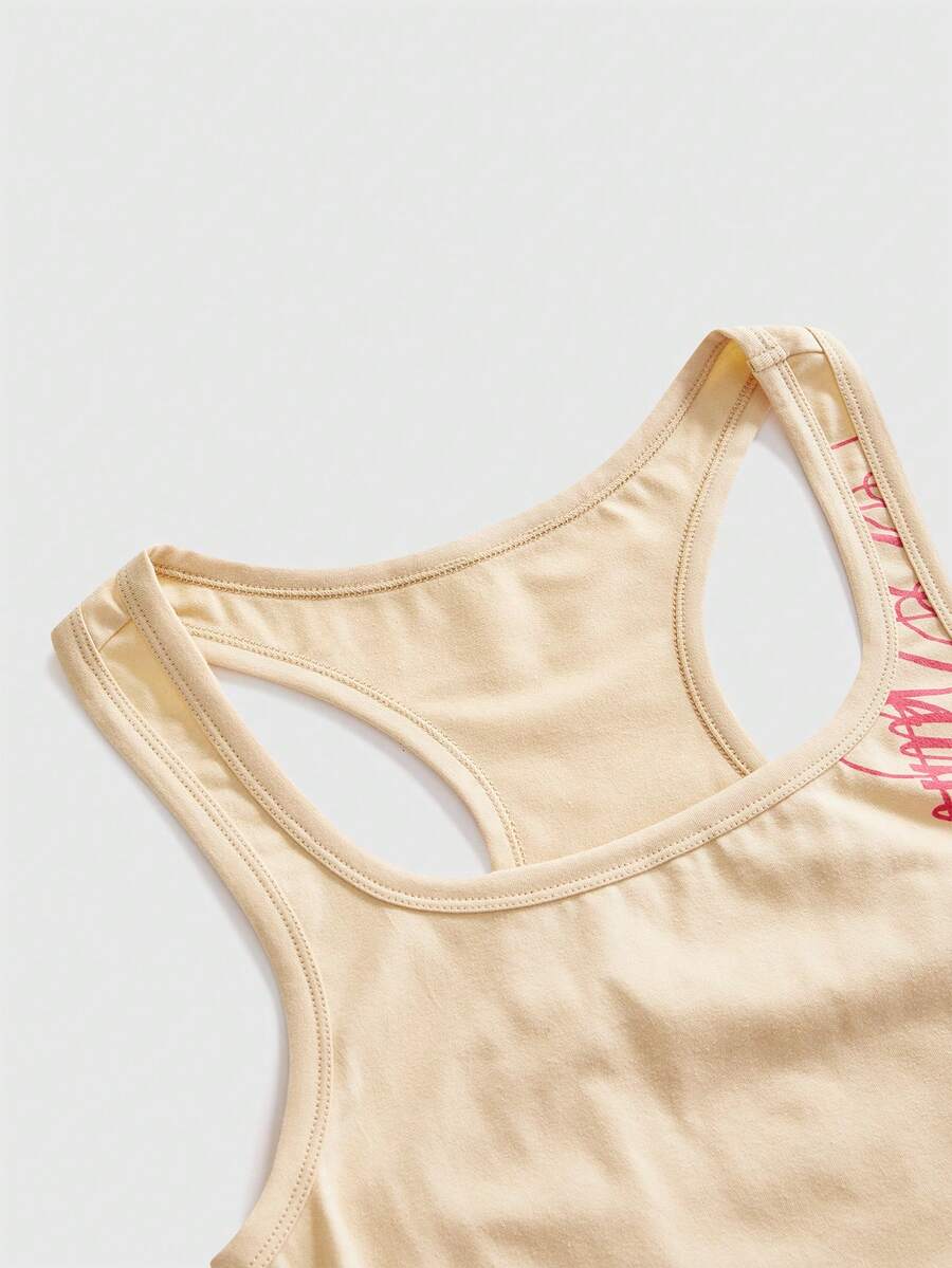Punk-inspired two-piece set with a fitted scoop neck slogan tank top featuring cross and rhinestone details paired with ultra low waist mini shorts.