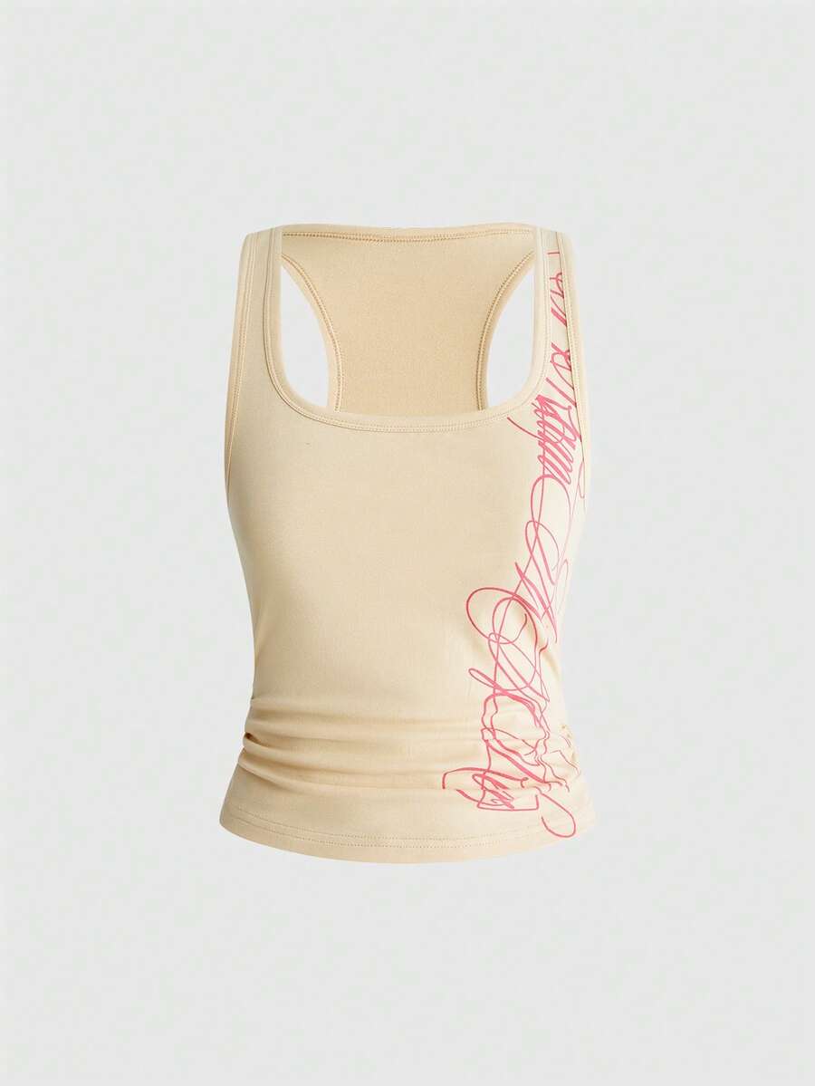 Punk-inspired two-piece set with a fitted scoop neck slogan tank top featuring cross and rhinestone details paired with ultra low waist mini shorts.