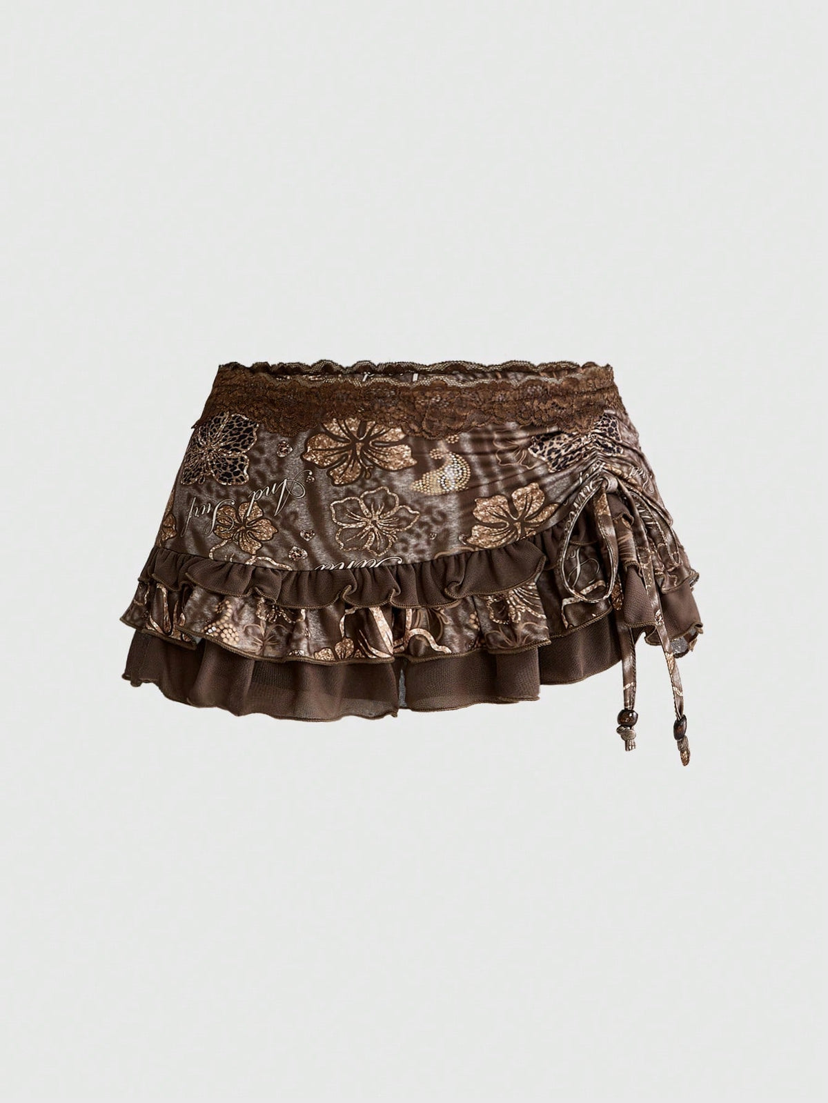 Women's black low-waist mini skirt with drawstring tie, ruched details, lace trim, layered ruffle hem, and asymmetric styling