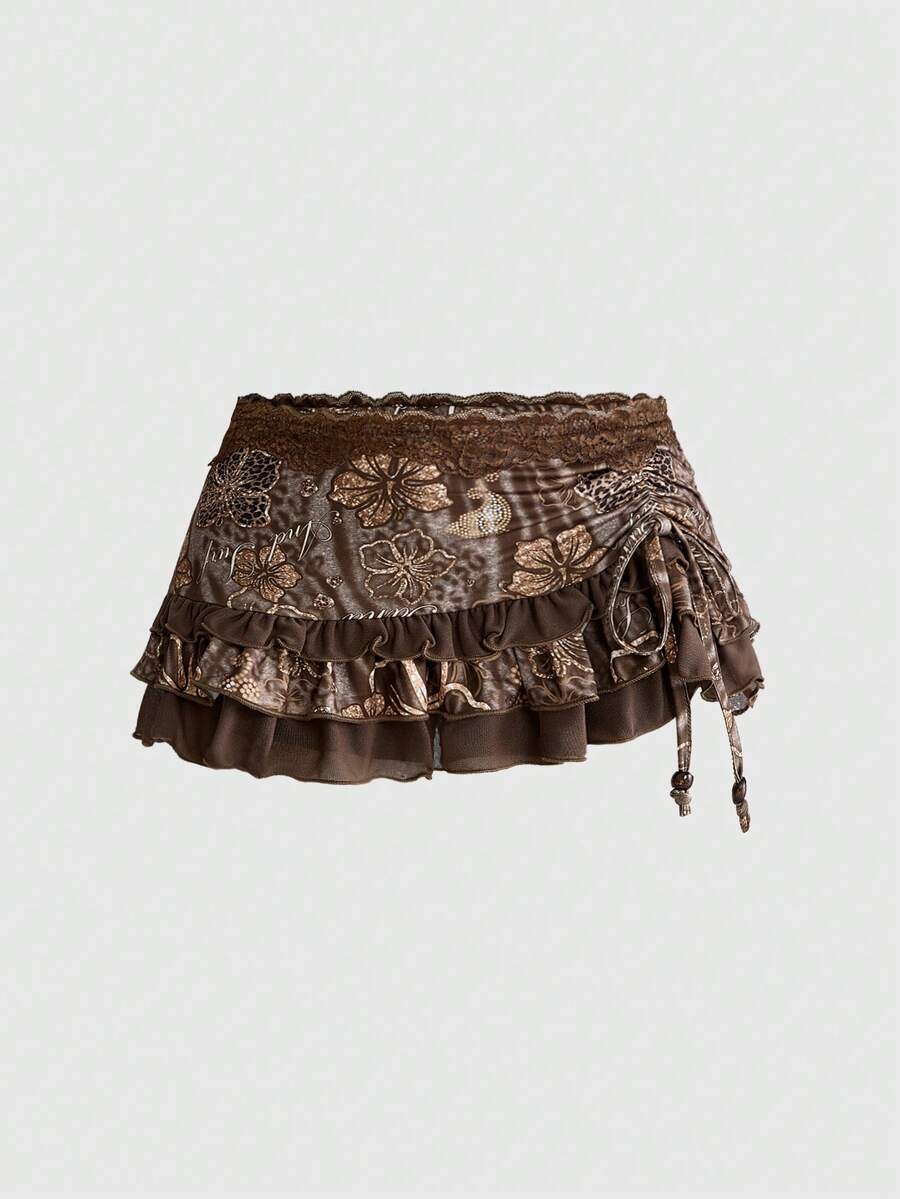 Women's black low-waist mini skirt with drawstring tie, ruched details, lace trim, layered ruffle hem, and asymmetric styling
