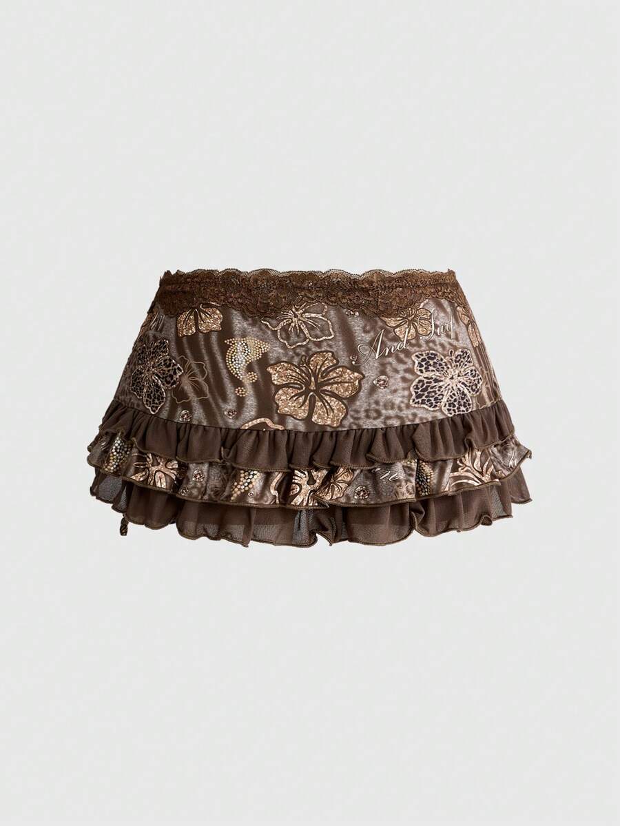 Women's black low-waist mini skirt with drawstring tie, ruched details, lace trim, layered ruffle hem, and asymmetric styling