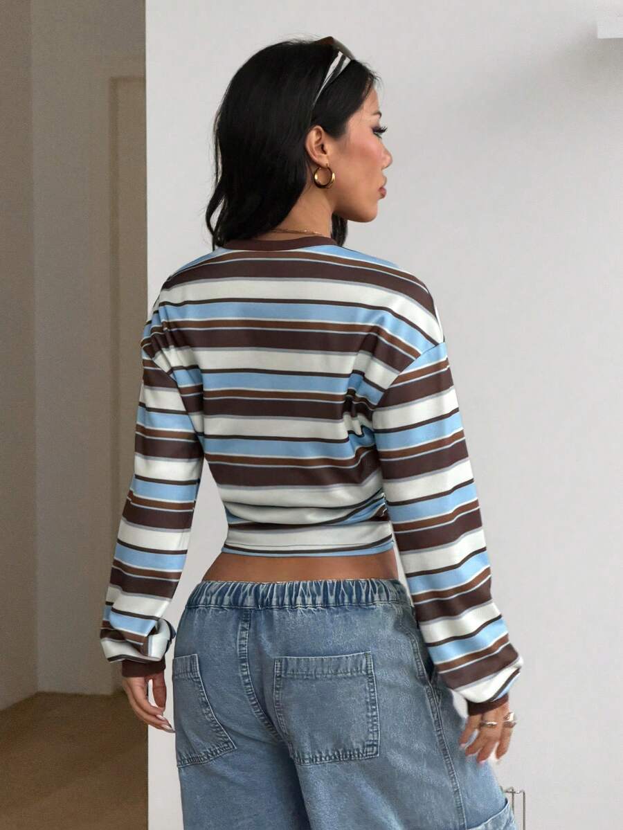 Women's striped pullover sweatshirt featuring drop shoulder long sleeves and a classic round neckline.
