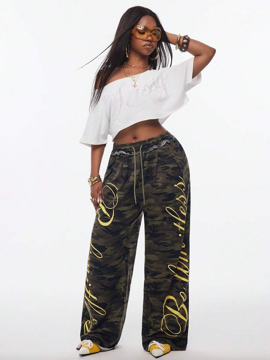 Women's casual straight leg baggy lounge pants in light grey with an adjustable drawstring waist and side pockets.